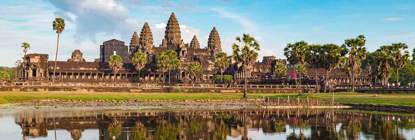 Angkor wat sunny day blue sky main facade reflection on water pond sunset light