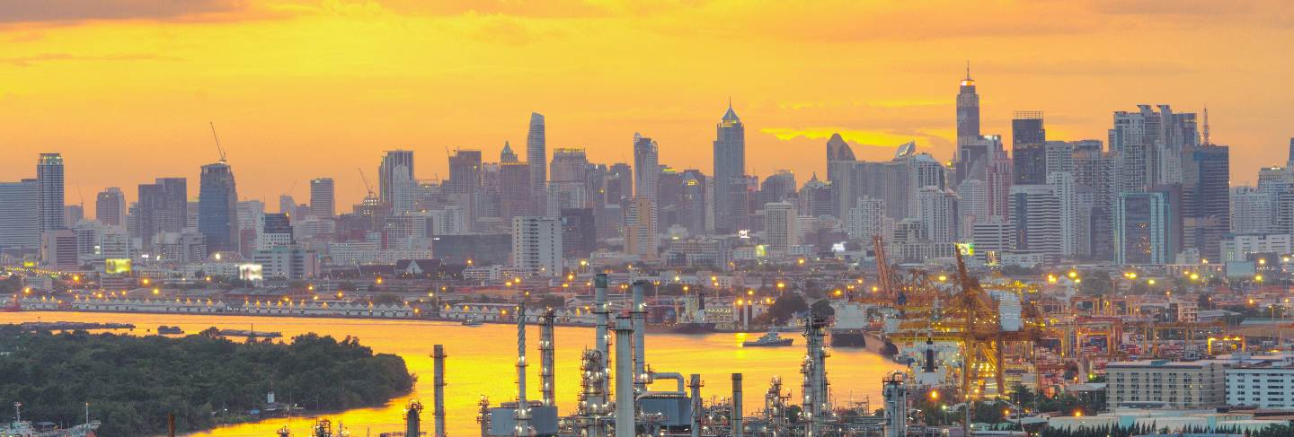 Oil refinery and oil thank in sunset background
