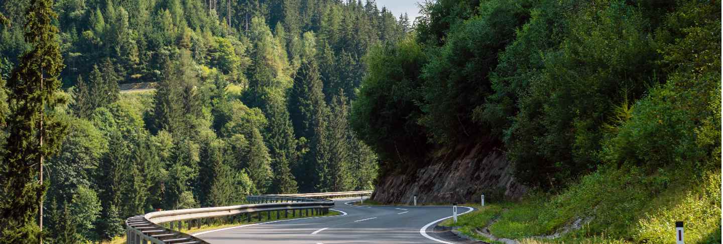 A picturesque asphalted mountain road through the alps. Austria.
