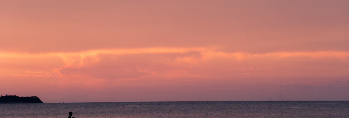 Beautiful sunset on the beach and silhouette boat, samui island thailand
