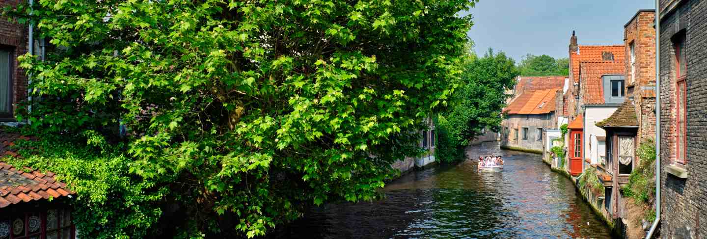 Tourist boat in canal. brugge bruges, belgium
