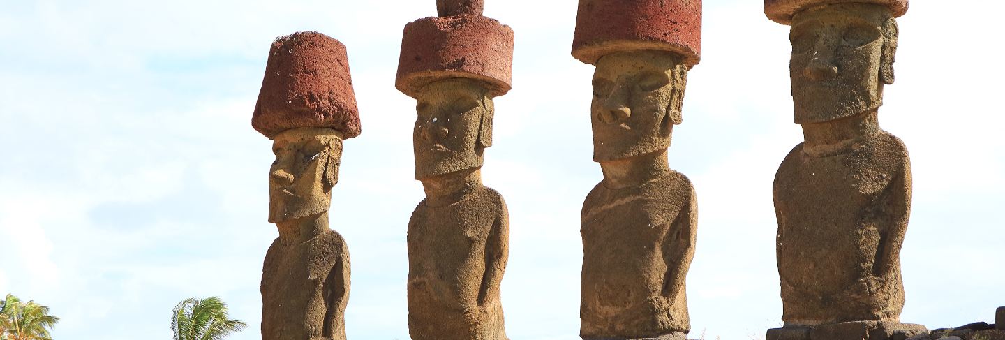 Four of seven gigantic moai of ahu nau nau, anakena beach, easter island, chile