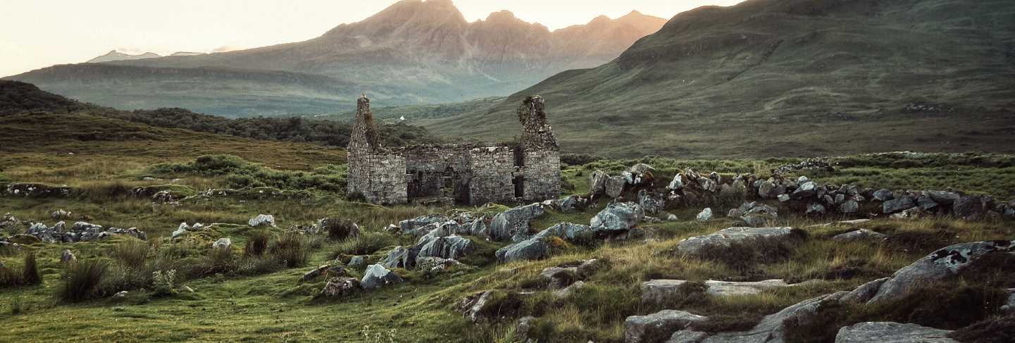 Beautiful rocky field with destroyed building
