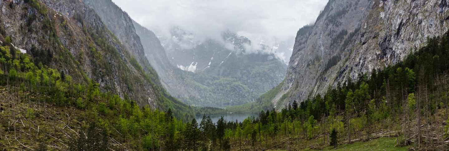 Scenic mountain panorama with green meadows and idyllic turquoise
