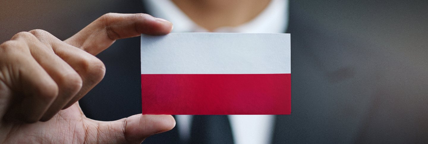 Businessman holding card poland flag
