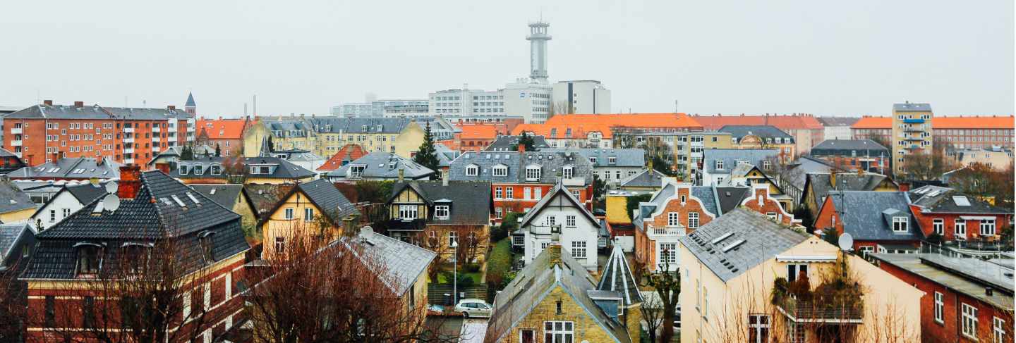 Wide shot of houses and buildings in the city of copenhagen, denmark
