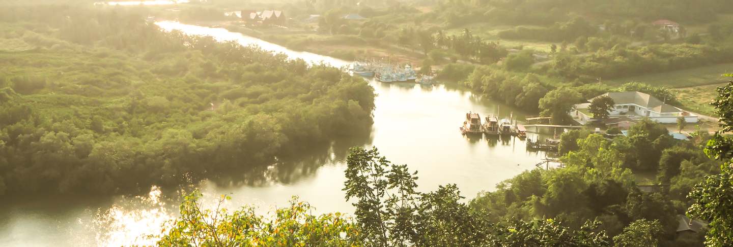 Top view of rainforest and city river sea and mountain in thailand
