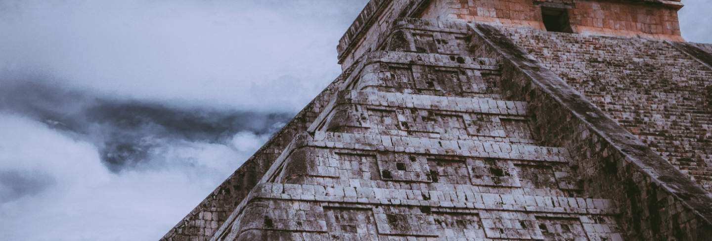 Beautiful shot of the chichen itza with cloudy sky
