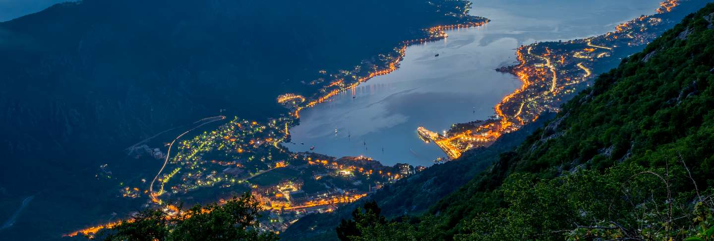 View of kotor bay from a high mountain peak at sunset.
