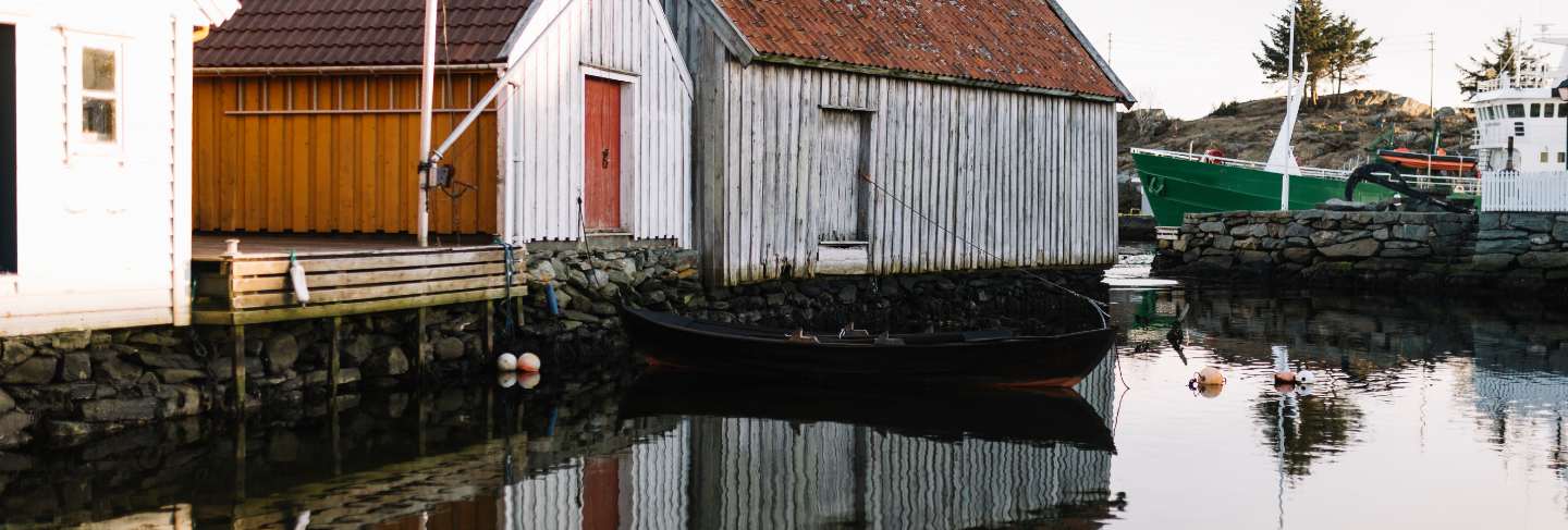 Wood houses reflected in the water
