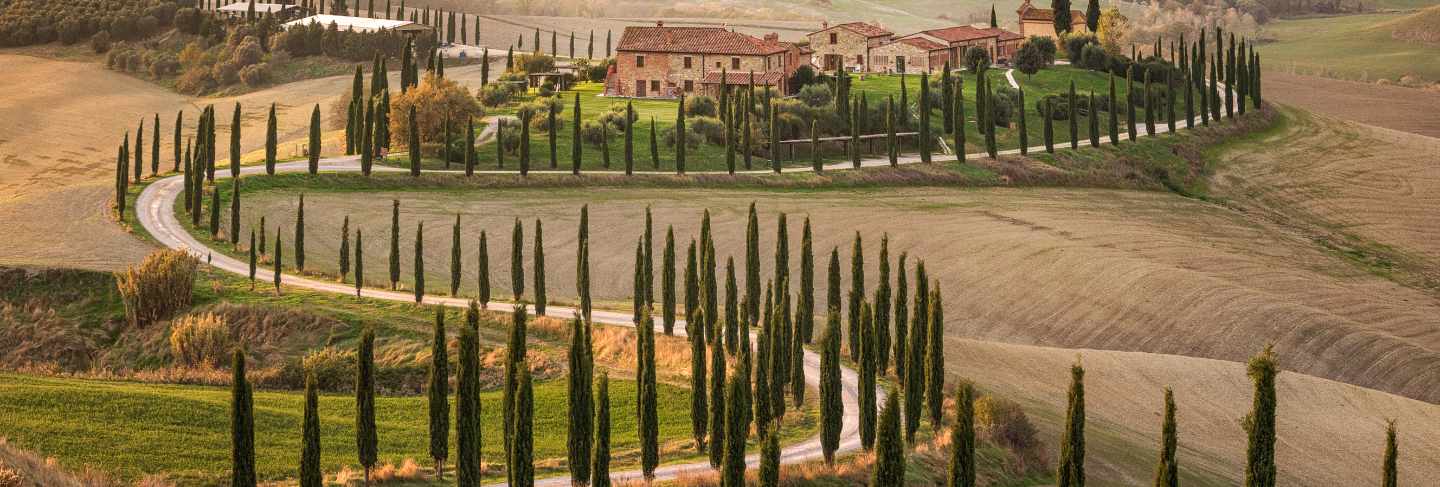 Common italian countryside. farm house and amazing fields near val d'orcia. tuscany. siena. italy. europe
