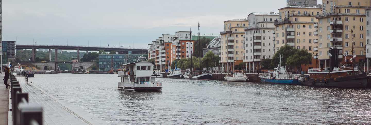 Sailing boats and yachts on the pier in stockholm front of the city center
