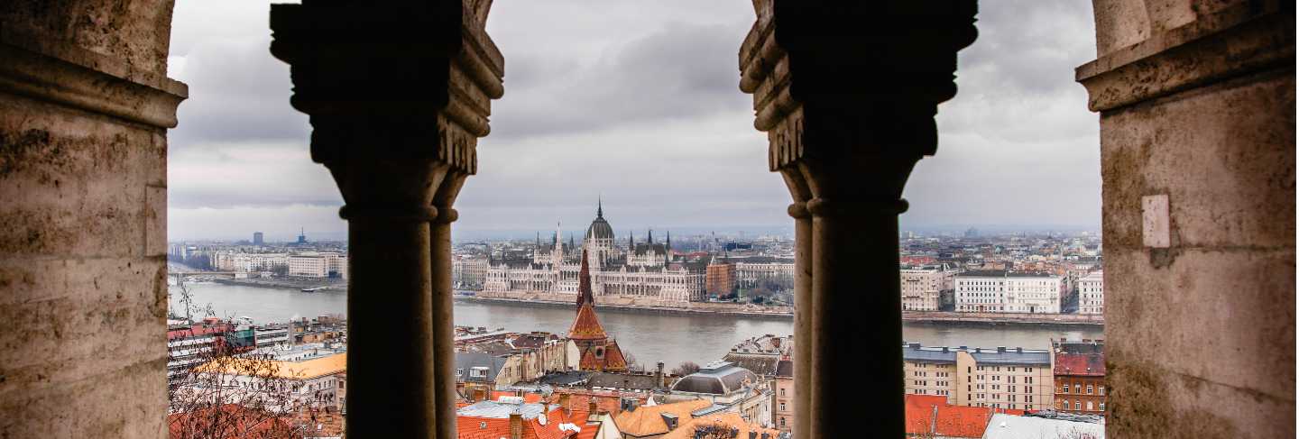 Views of the hungarian parliament through the walls of the budapest castle
