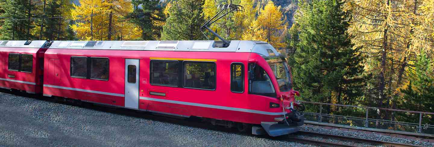 Swiss mountain train Bernina express crossed alps in autumn