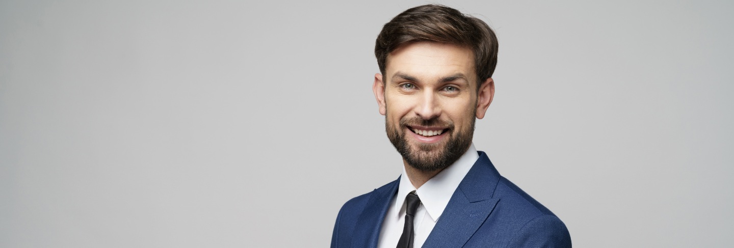 Portrait of businessman talking on phone in office
