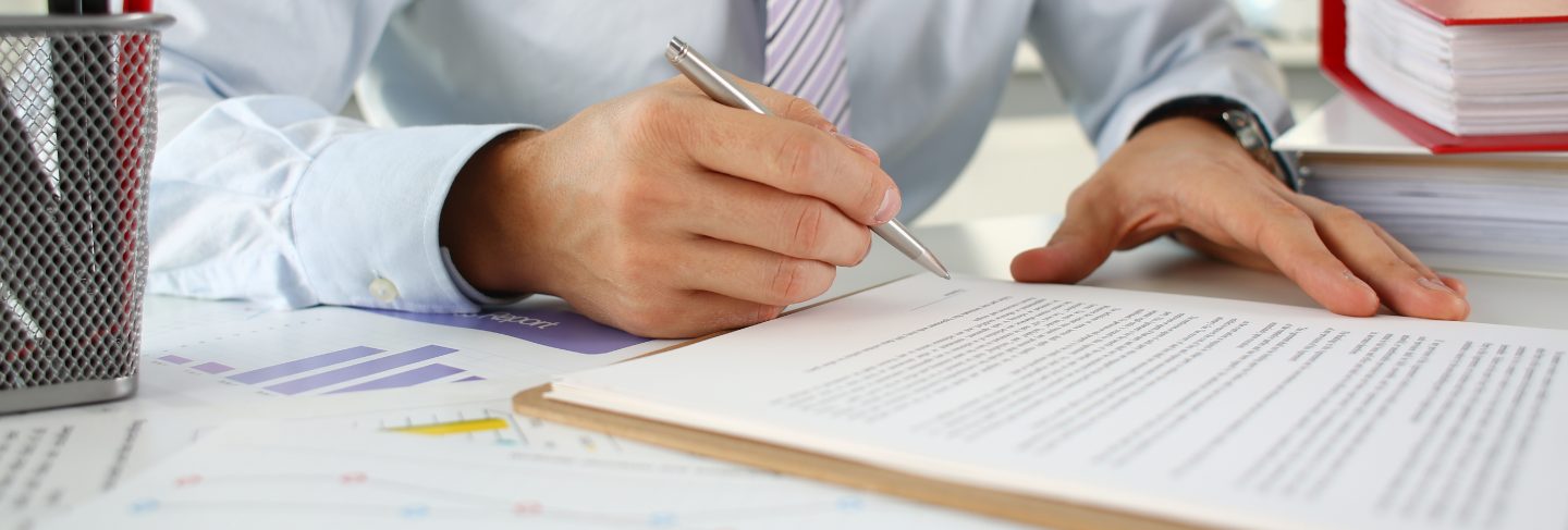 Hand of businessman in suit filling
