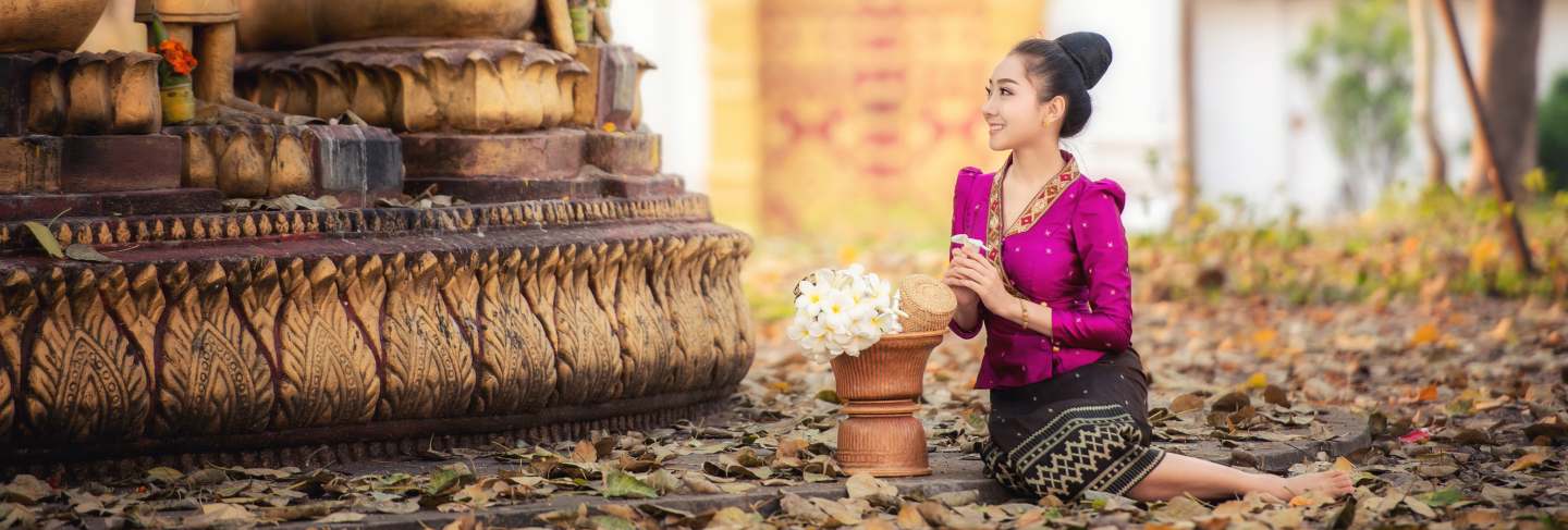 Beautiful laos girl in laos traditional costume, vintage style at vientiane, laos.
