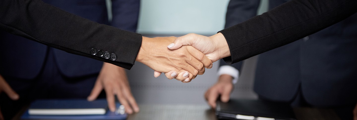 Crop businesspeople shaking hands
