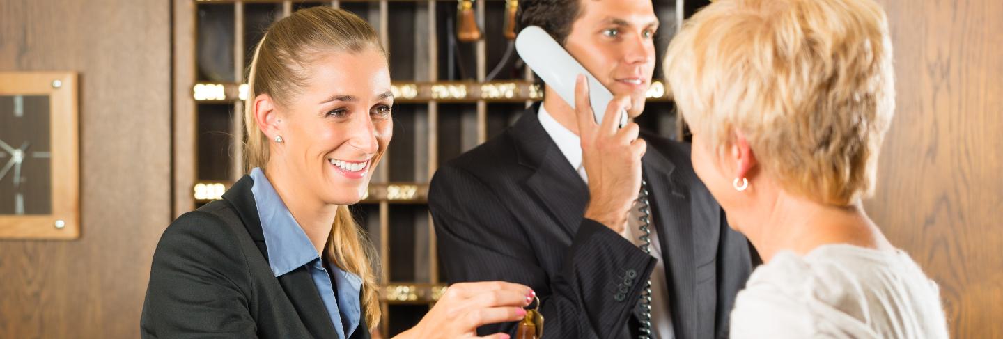 Reception, guest checking in a hotel
