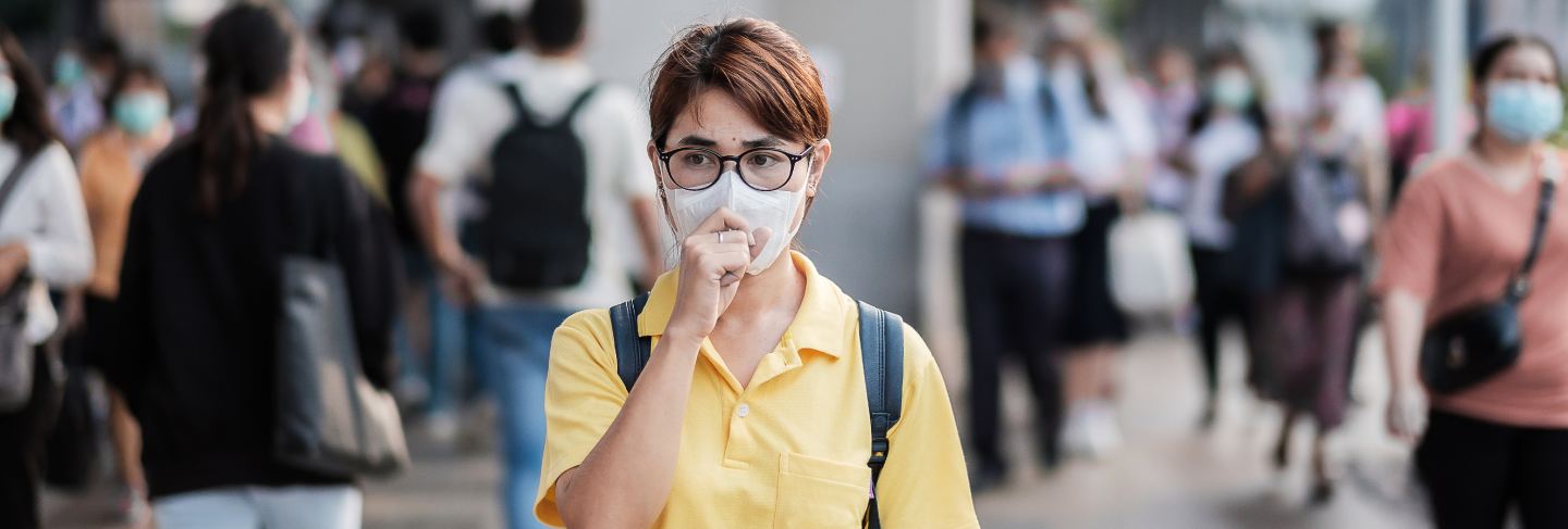Young asian woman wearing protection mask against novel coronavirus (2019-ncov) or wuhan coronavirus at public train station,is a contagious virus that causes respiratory infection.
