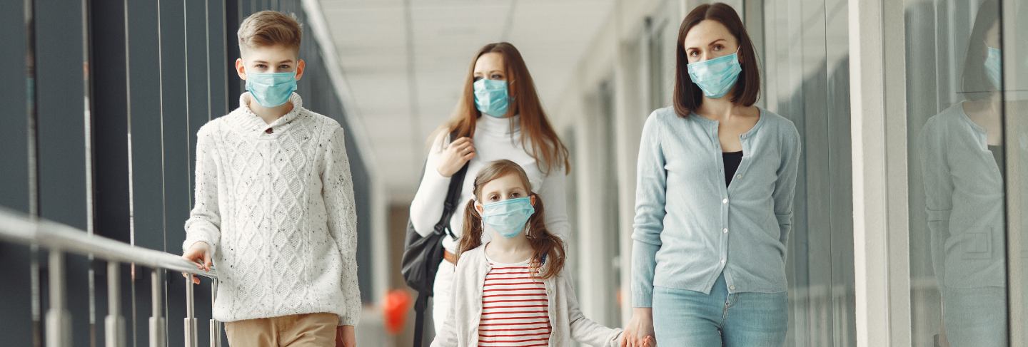 People in airport are wearing masks to protect themselves from virus
